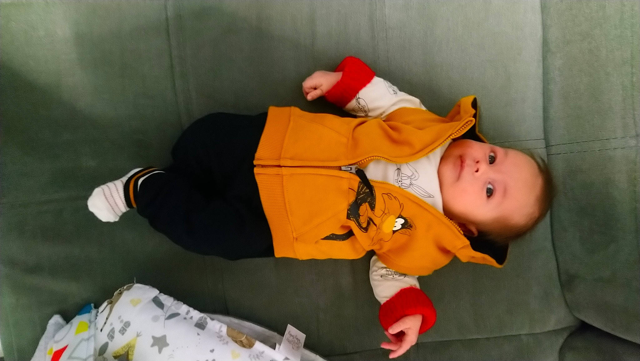 Paolo a rejoint le concours — aidez-le/la à gagner de superbes lots ! baby, baby_products, baby_toddler_clothing, child, comfort, fun, hat, lap, orange, person, room, sitting, sleeve, smile, toddler