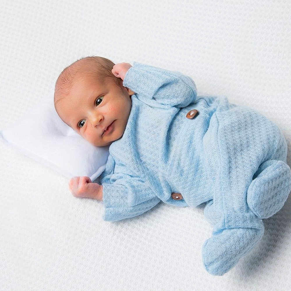 Lorenzo participe au concours pour gagner de l'argent avec cette photo : baby, blanket, bonnet, clothing, face, fashion, happy, hat, head, knitwear, newborn, person, photography, portrait, reading, robe, sleeping, smile, sweater, toy