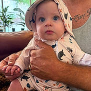 Lincoln joined the competition — help win amazing prizes! adult, baby, beard, child, clothing, couch, cute, expression, face, hand, hat, holding, indoor, infant, person, plant, portrait, seated, tattoo, window