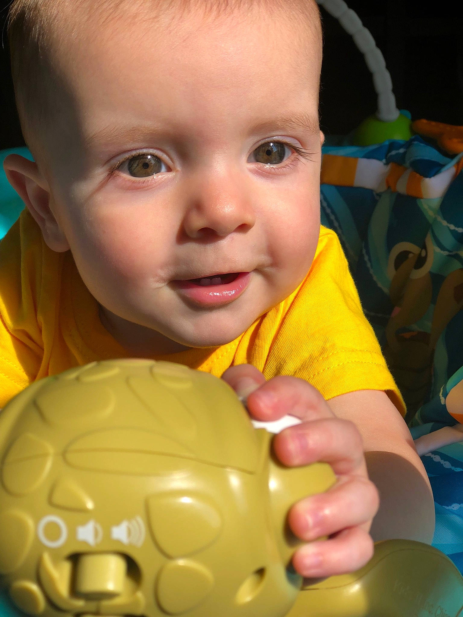 Joey joined the competition — help win amazing prizes! baby, baby_playing_with_toys, baby_toys, ball, child, eye, face, facial_expression, fun, head, person, play, skin, smile, toddler, yellow