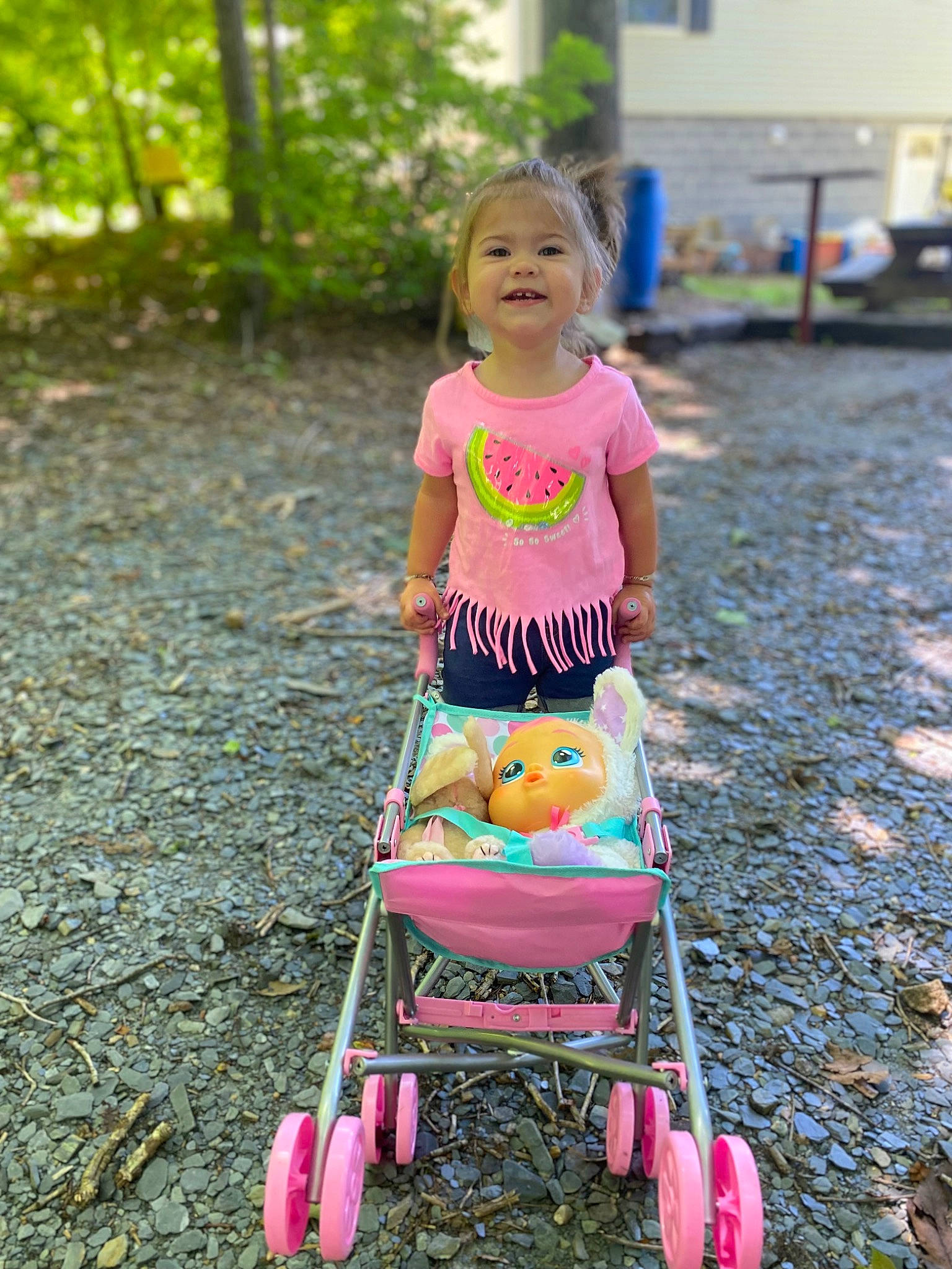 Payton is registered to the contest to win money with this photo: baby, baby_carriage, baby_products, child, fun, grass, happy, joy, leisure, magenta, people, people_in_nature, person, pink, plant, recreation, smile, snapshot, tire, toddler