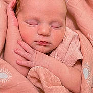 Charleigh joined the competition — help win amazing prizes! baby, newborn, sleeping, pink_blanket, soft_texture, hand, face, peaceful, wrapped, infant, portrait, closeup, skin, cute, resting, child, warm, cozy, patterned_fabric, toddler