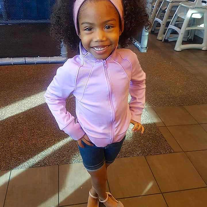 Zoe Guerrero is registered to the contest to win money with this photo: abdomen, beauty, child, cool, day, fun, girl, human, joy, material, person, pink, product, purple, shoe, shoulder, skin, smile, standing, textile