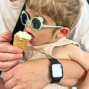 Malo a rejoint le concours — aidez-le/la à gagner de superbes lots ! toddler, child, ice_cream, sunglasses, adult_hand, watch, cone, food, summer, casual_clothing, closeup, holding, cute, eating, fun, bonding, portrait, person, happy, family