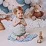 Malo a rejoint le concours — aidez-le/la à gagner de superbes lots ! toddler, child, baby, smiling, sitting, blue_mat, wooden_toys, teddy_bear, balloons, clouds, moon, stars, background, indoor, portrait, cute, soft_lighting, happy, playful, nursery