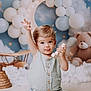 Malo participe au concours pour gagner de l'argent avec cette photo : toddler, child, baby, toy, balloon, crescent_moon, stars, teddy_bear, clouds, blue_mat, nursery, playful, cute, indoor, portrait, smiling, wooden_toy, decorations, background, seated