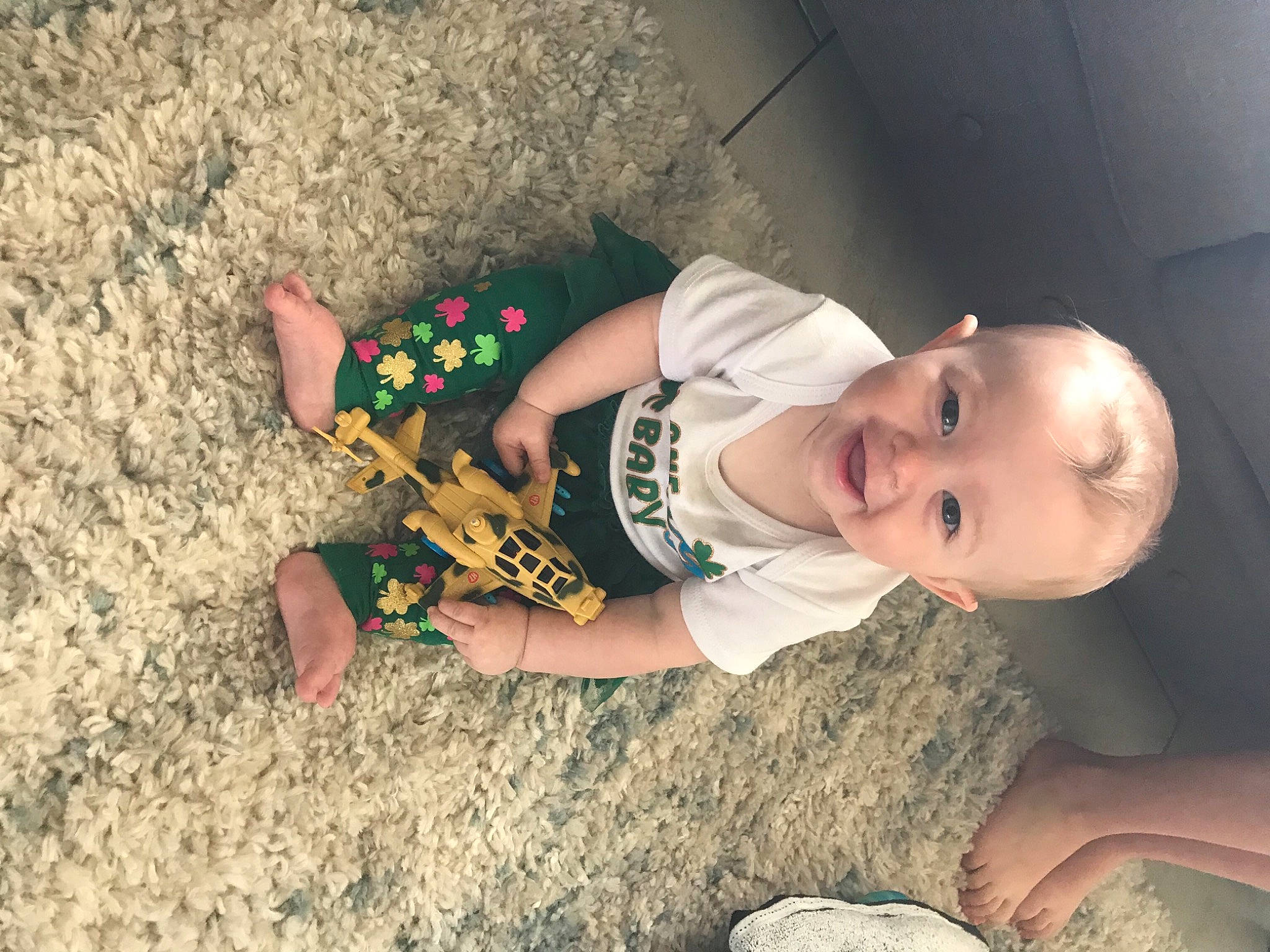 Carolina is registered to the contest to win money with this photo: arm, baby, baby_toddler_clothing, child, elbow, finger, flash_photography, fun, grass, happy, hat, human_leg, joy, landscape, mouth, person, play, sand, sitting, smile