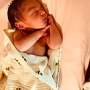 Lilah joined the competition — help win amazing prizes! newborn, baby, sleeping, blanket, bee_pattern, infant, peaceful, soft_texture, skin, cute, resting, child, closeup, indoors, warm_colors, portrait, wrapped, bed, toddler, cozy