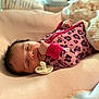 baby, newborn, infant, sleeping, pacifier, pink, blanket, onesie, leopard_print, soft, cute, hand, face, cozy, resting, bed, toddler, child, indoors, person