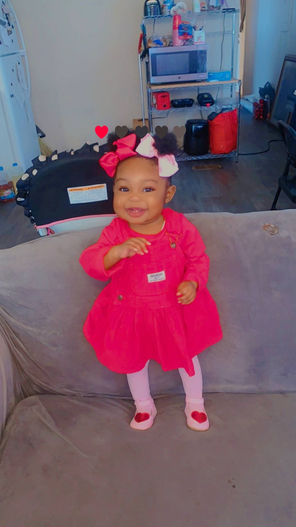 Kyler is registered to the contest to win money with this photo: baby_toddler_clothing, child, costume, couch, event, floor, flooring, fun, hat, holiday, home_appliance, house, joy, living_room, magenta, person, pink, room, smile, television