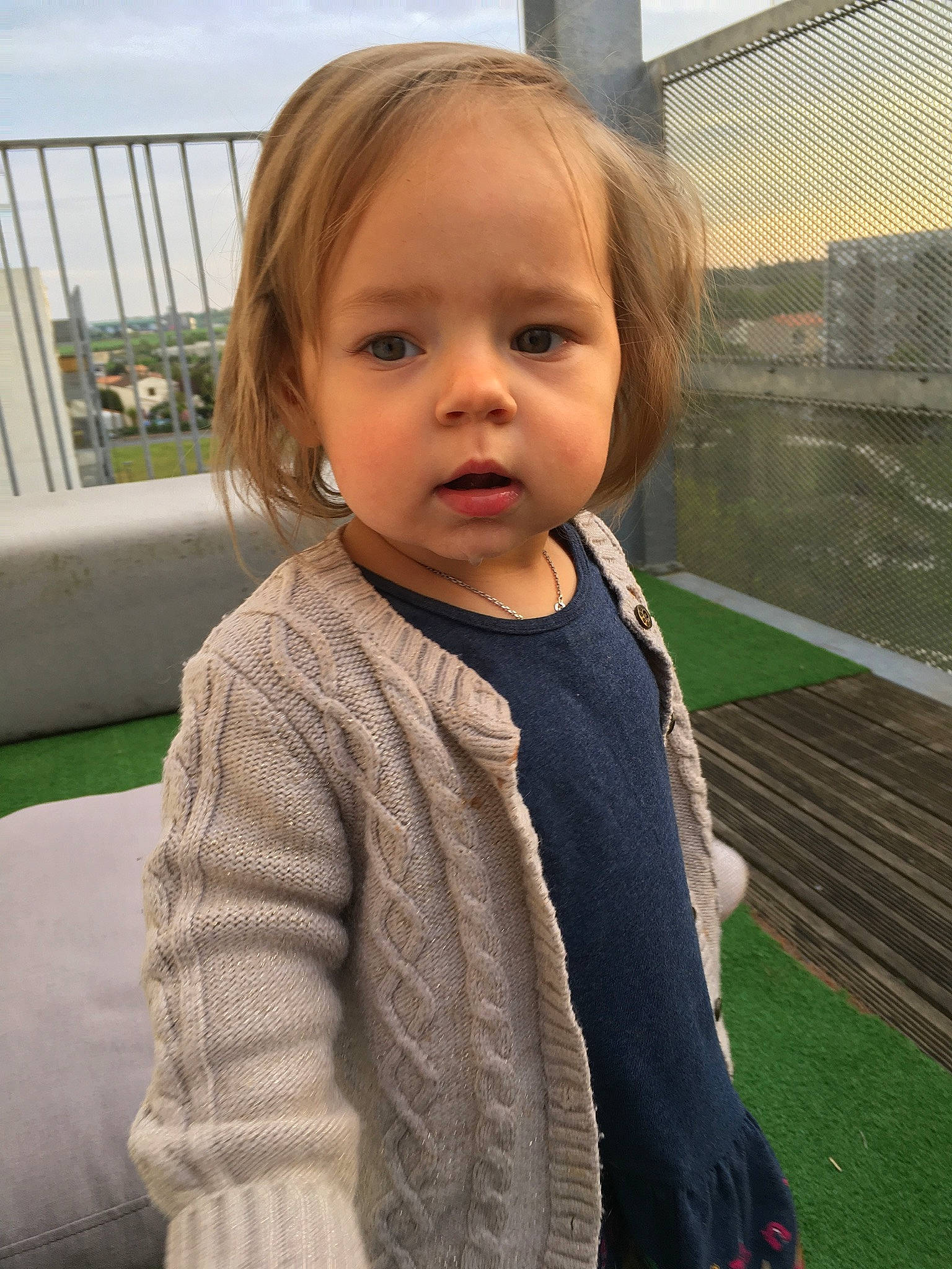 Opale participe au concours pour gagner de l'argent avec cette photo : baby_toddler_clothing, cheek, child, eye, fun, grass, hair, hairstyle, happy, head, iris, jacket, leisure, lip, person, sitting, skin, sky, sleeve, toddler