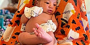 Alìze joined the competition — help win amazing prizes! baby, infant, blanket, orange, mittens, lying_down, cute, indoors, soft_texture, pattern, foot, hand, skin, face, newborn, relaxed, colorful, person, comfort, cozy