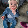 baby, infant, child, sitting, hat, animal_hat, blue_eyes, onesie, whale_print, finger_in_mouth, playpen, ball_pit, wooden_floor, pink_slipper, rug, gaze, portrait, home_interior, crawling_mat, cute_expression