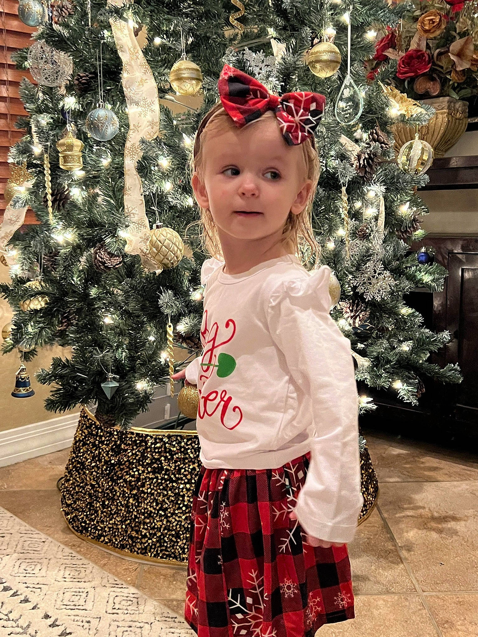 Paige joined the competition — help win amazing prizes! baby_toddler_clothing, christmas, christmas_decoration, christmas_eve, christmas_ornament, christmas_tree, costume_hat, event, fashion, happy, headwear, holiday, holiday_ornament, ornament, people, person, red, sleeve, snapshot, standing