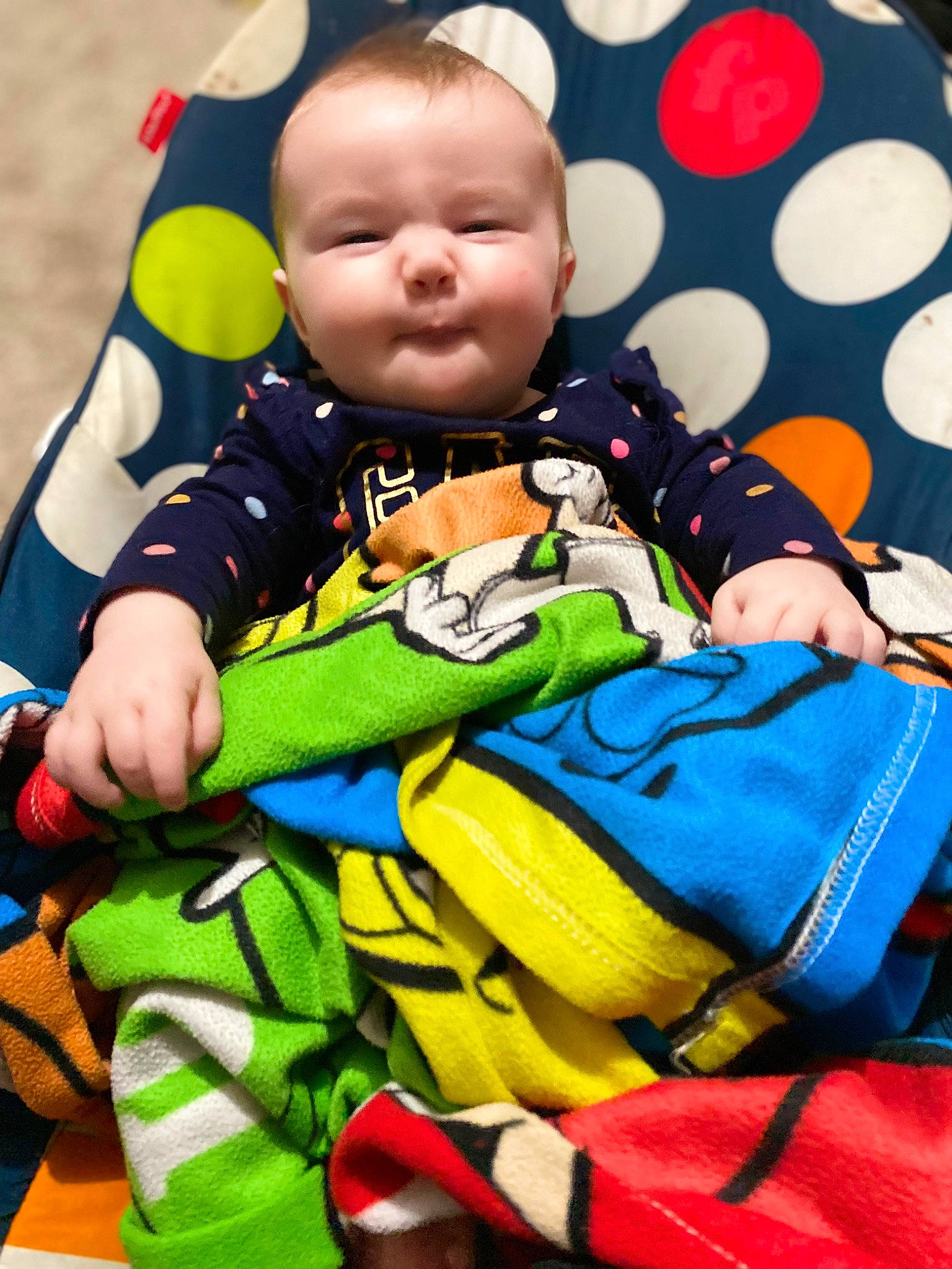 Mckinley is registered to the contest to win money with this photo: baby, baby_products, baby_safety, baby_sleeping, baby_toddler_clothing, baby_toys, bag, cheek, child, comfort, electric_blue, fun, happy, linens, pattern, person, sitting, sleeve, smile, toddler