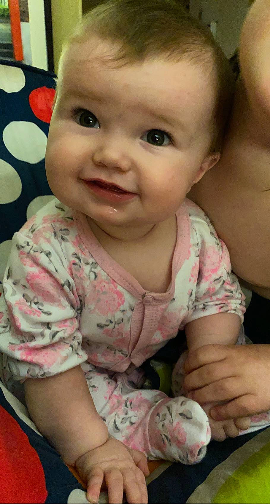 Mckinley is registered to the contest to win money with this photo: arm, baby, baby_toddler_clothing, cheek, chin, eye, eyebrow, face, facial_expression, hairstyle, head, human_body, lip, mouth, nose, organ, person, photograph, skin, sleeve