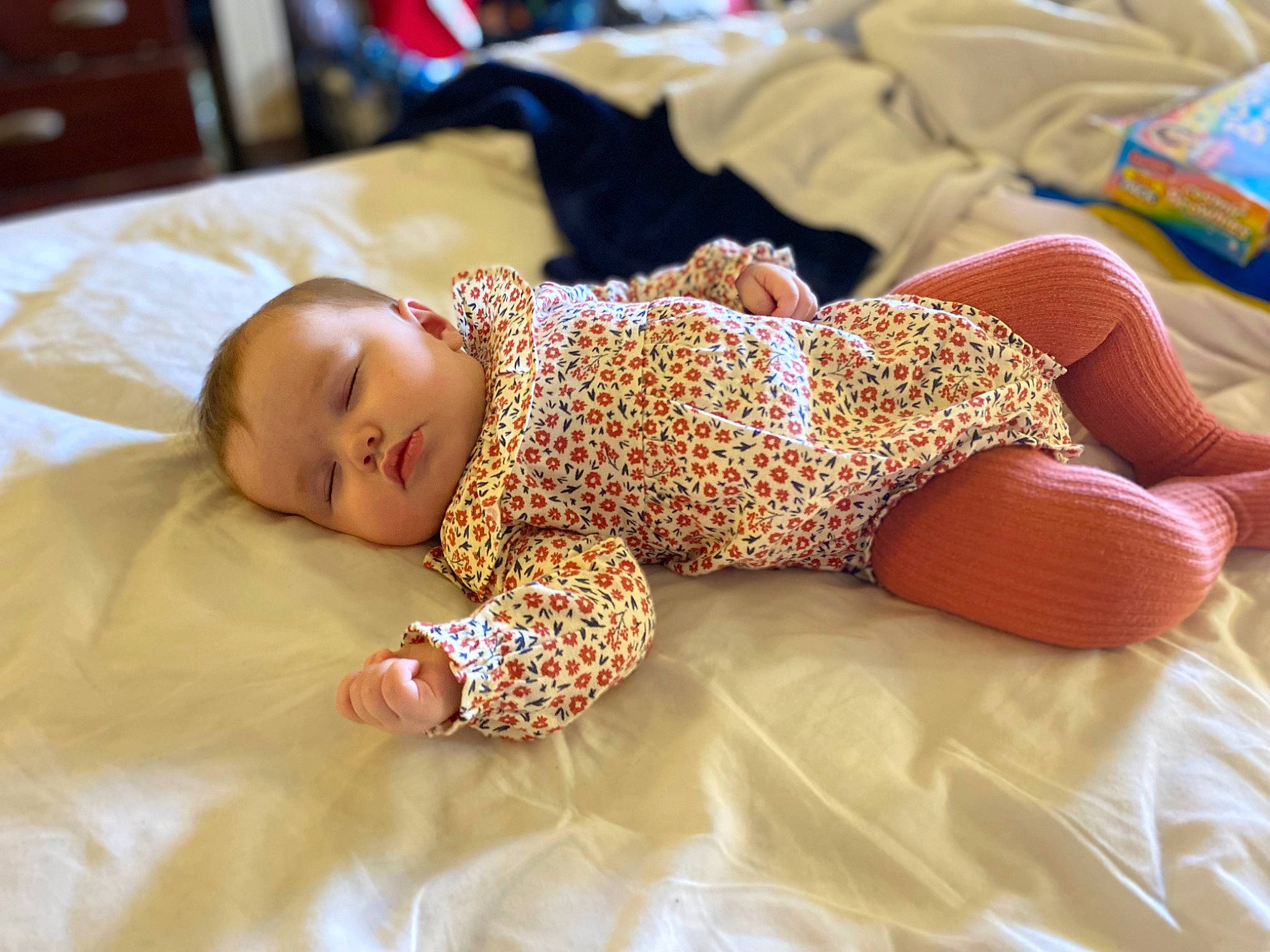 Mckinley joined the competition — help win amazing prizes! baby, baby_sleeping, baby_toddler_clothing, bedding, bedtime, child, comfort, couch, flooring, foot, human_leg, knee, linens, pattern, person, room, sitting, skin, sleeve, toddler
