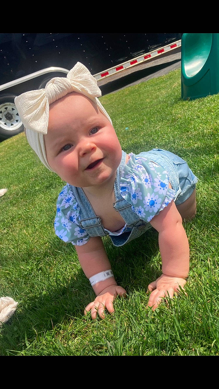 Tessa joined the competition — help win amazing prizes! baby, baby_toddler_clothing, barefoot, child, electric_blue, finger, fun, grass, grassland, green, happy, human_leg, lawn, leisure, people_in_nature, person, recreation, smile, tire, toddler