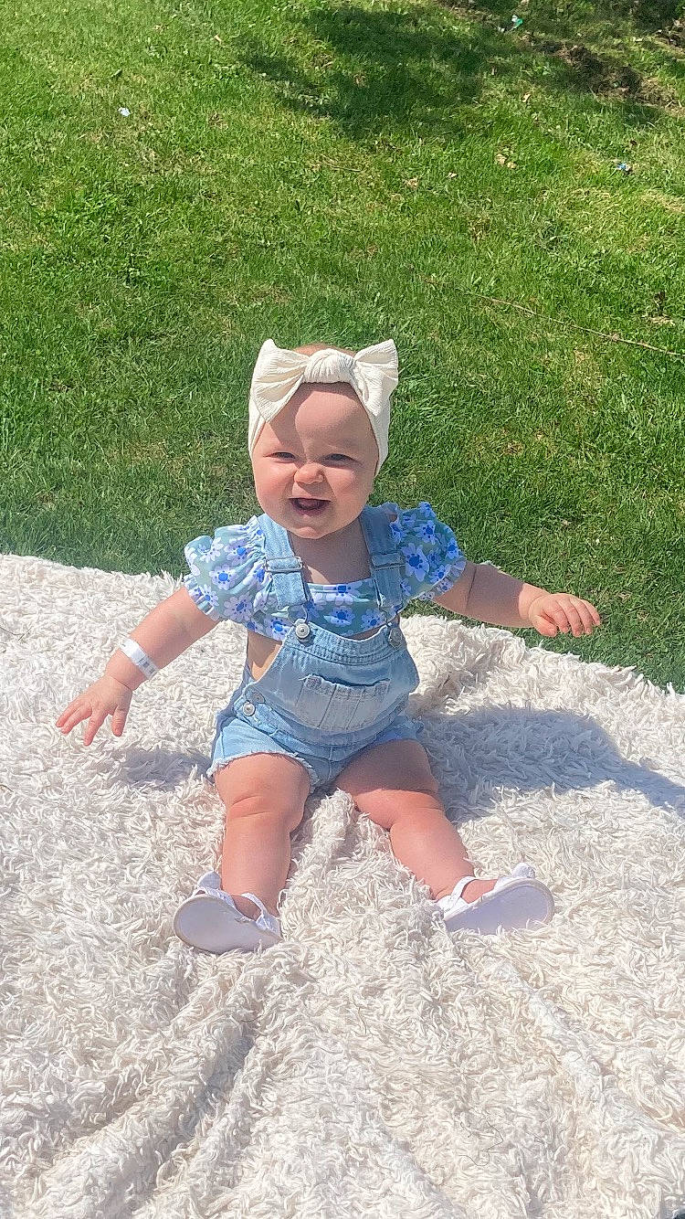 Tessa joined the competition — help win amazing prizes! baby, baby_toddler_clothing, barefoot, child, foot, fun, grass, grass_family, happy, headwear, human_leg, lawn, leisure, pattern, people_in_nature, person, play, sand, shadow, sitting