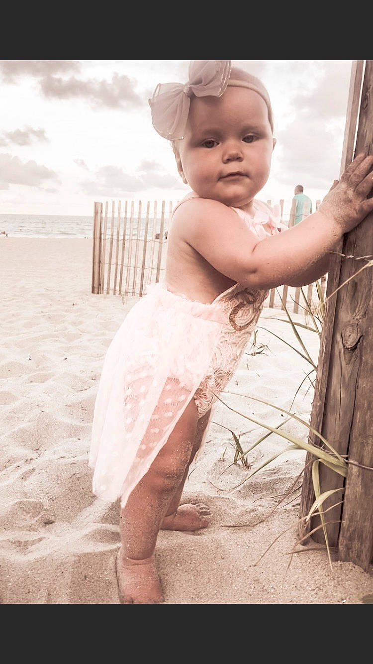 Tessa joined the competition — help win amazing prizes! baby, barefoot, beach, child, cloud, flash_photography, fun, gesture, happy, human_leg, monochrome, monochrome_photography, ocean, people_in_nature, people_on_beach, person, portrait_photography, sitting, sky, toddler