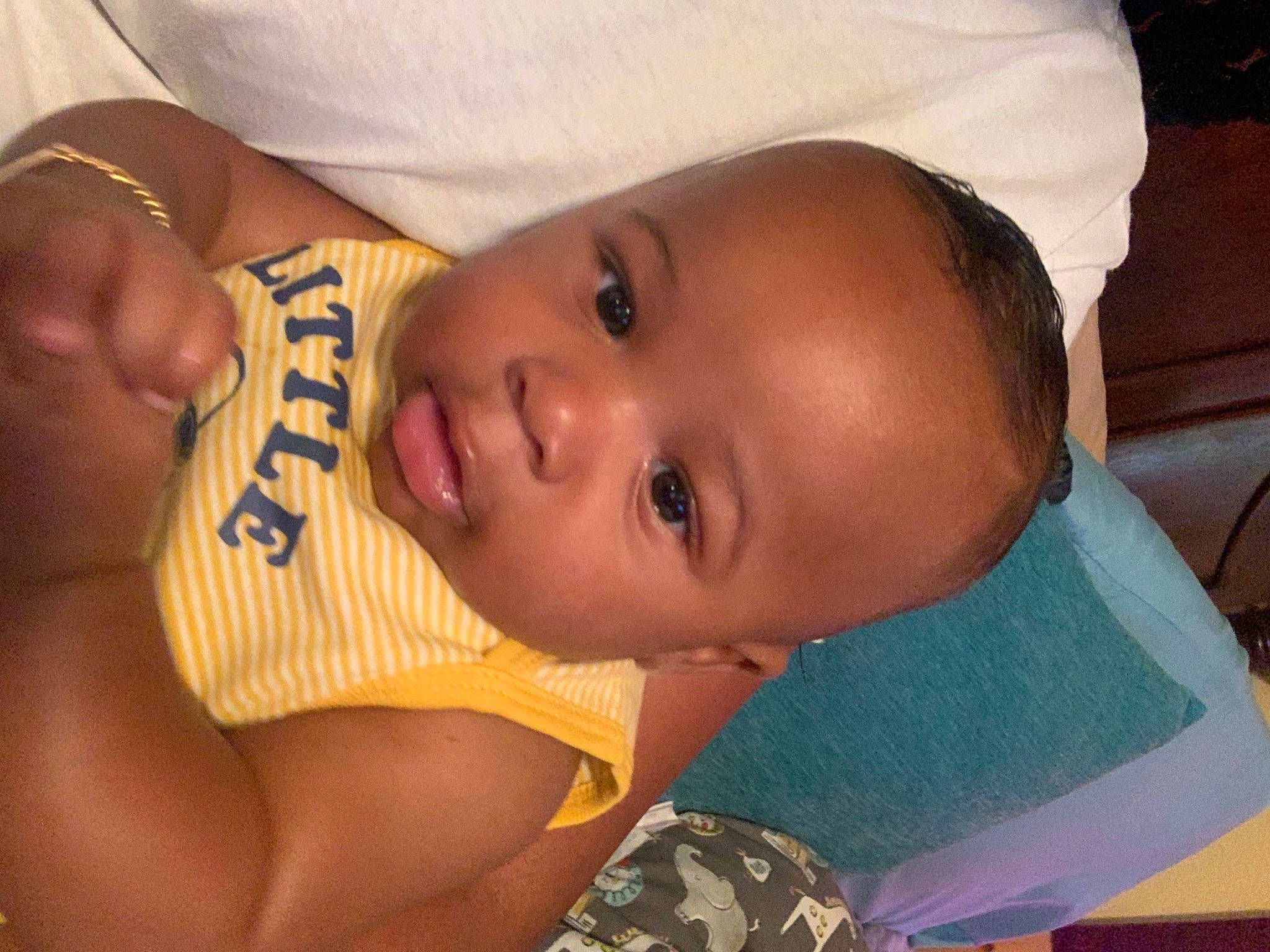 Knowledge is registered to the contest to win money with this photo: baby, baby_toddler_clothing, cheek, chin, ear, eye, eyebrow, eyelash, finger, forehead, happy, head, headgear, human_body, iris, lip, mouth, neck, nose, person