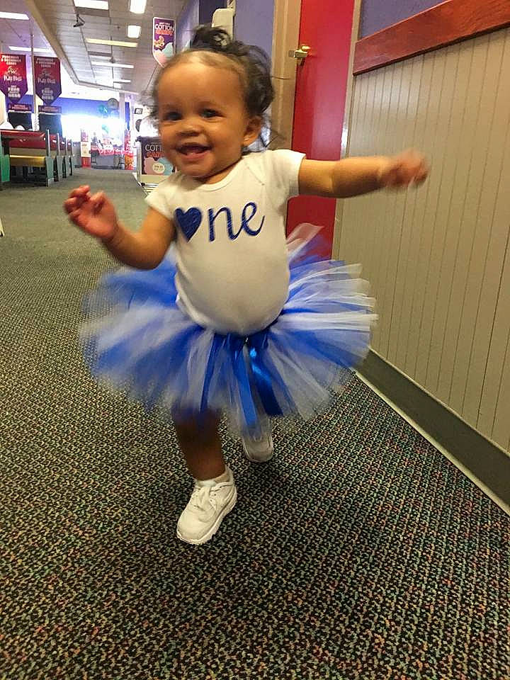 Aminah joined the competition — help win amazing prizes! arm, ballet_tutu, blue, child, clothing, costume, day, fun, girl, joy, performing_arts, person, play, smile, toddler