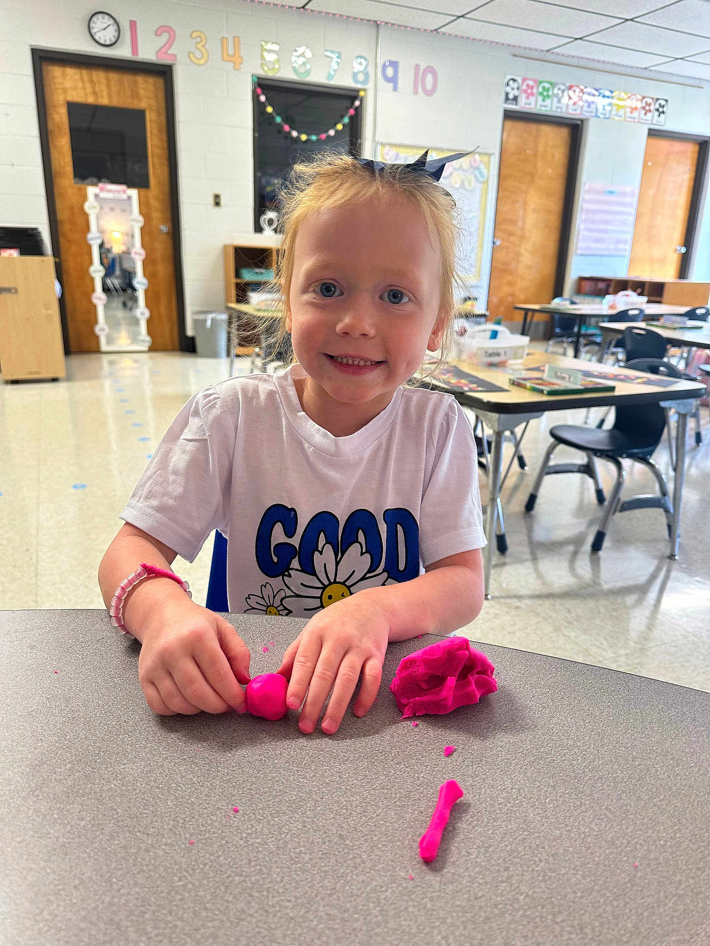 Baylee joined the competition — help win amazing prizes! architecture, bodypart, building, child, clothing, diningtable, face, female, finger, furniture, girl, hand, head, indoors, interiordesign, person, photography, portrait, t_shirt, table