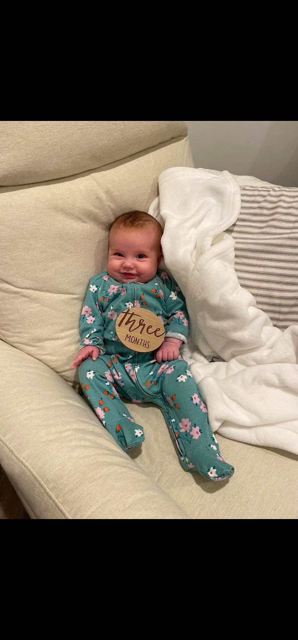 Olivia is registered to the contest to win money with this photo: baby, baby_products, baby_sleeping, baby_toddler_clothing, bedtime, child, comfort, couch, flooring, head, joy, linens, nap, person, portrait_photography, room, sitting, sleeve, sock, throw_pillow