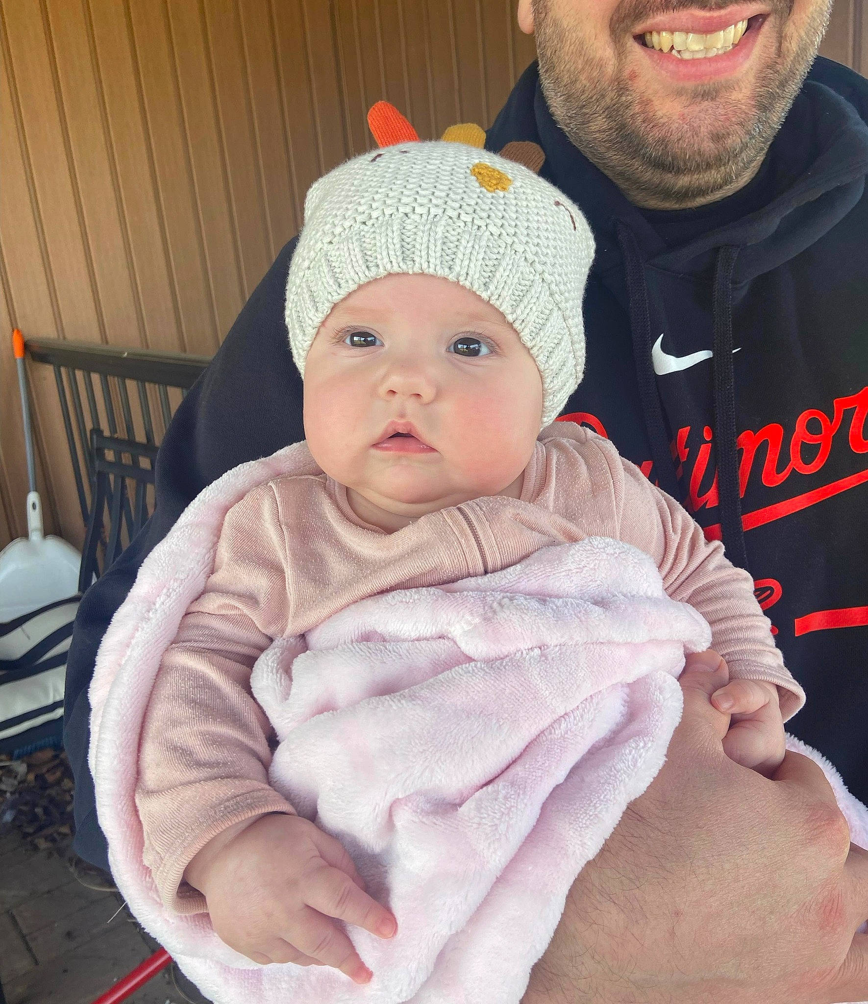 Olivia is registered to the contest to win money with this photo: baby, baby_toddler_clothing, beanie, beard, cap, cheek, child, comfort, fashion_accessory, happy, hat, headgear, headwear, knit_cap, outerwear, person, sitting, skin, sleeve, smile