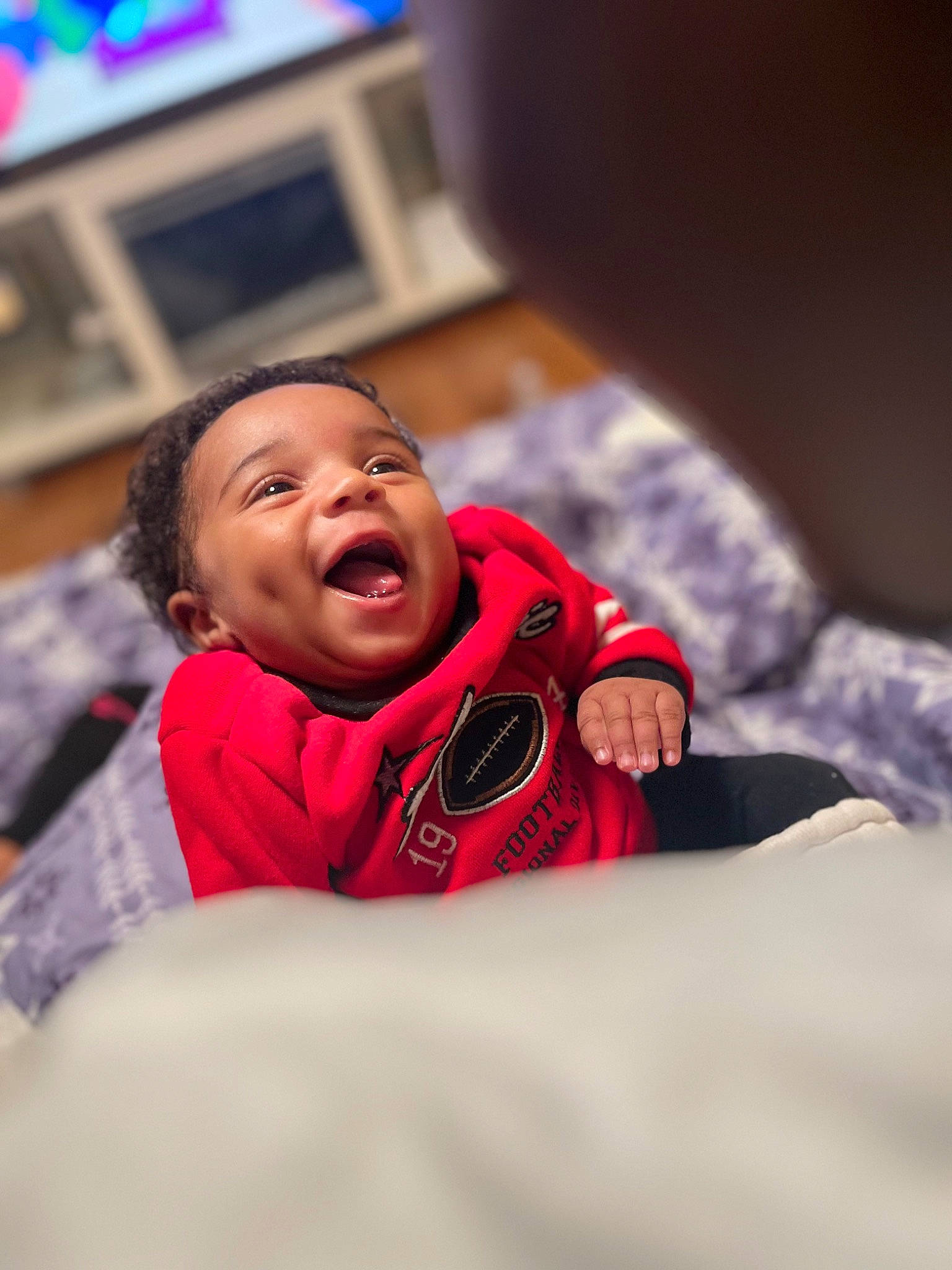 Kyree joined the competition — help win amazing prizes! baby, bed, carmine, child, comfort, couch, event, face, facial_expression, flash_photography, fun, fur, happy, jacket, leisure, person, picture_frame, room, sitting, television