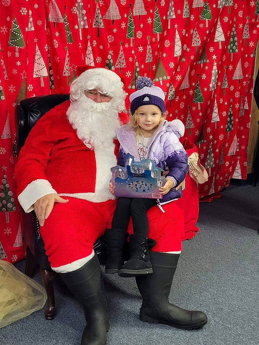 Legacy joined the competition — help win amazing prizes! beard, event, fictional_character, fun, fur, happy, hat, headgear, headwear, holiday, human_leg, interaction, knee, lap, motor_vehicle, person, red, santa_claus, snapshot, thigh