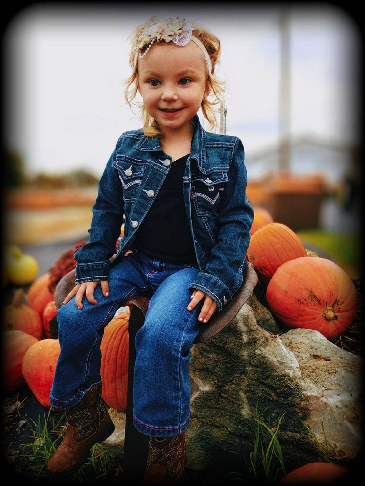 Legacy is registered to the contest to win money with this photo: calabaza, child, cucurbita, eye, facial_expression, flash_photography, gourd, grass, happy, jeans, joy, leg, people, people_in_nature, person, photograph, pumpkin, shoe, smile, squash