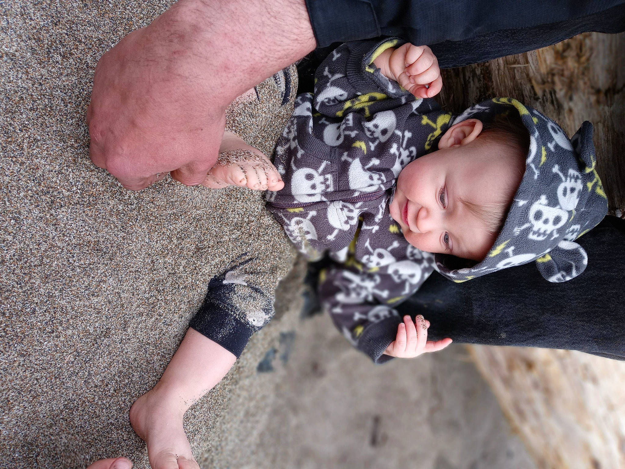 James is registered to the contest to win money with this photo: arm, baby, baby_toddler_clothing, barefoot, child, finger, fun, gesture, grass, hand, happy, headwear, military_camouflage, nail, people_in_nature, person, sand, soil, thigh, thumb