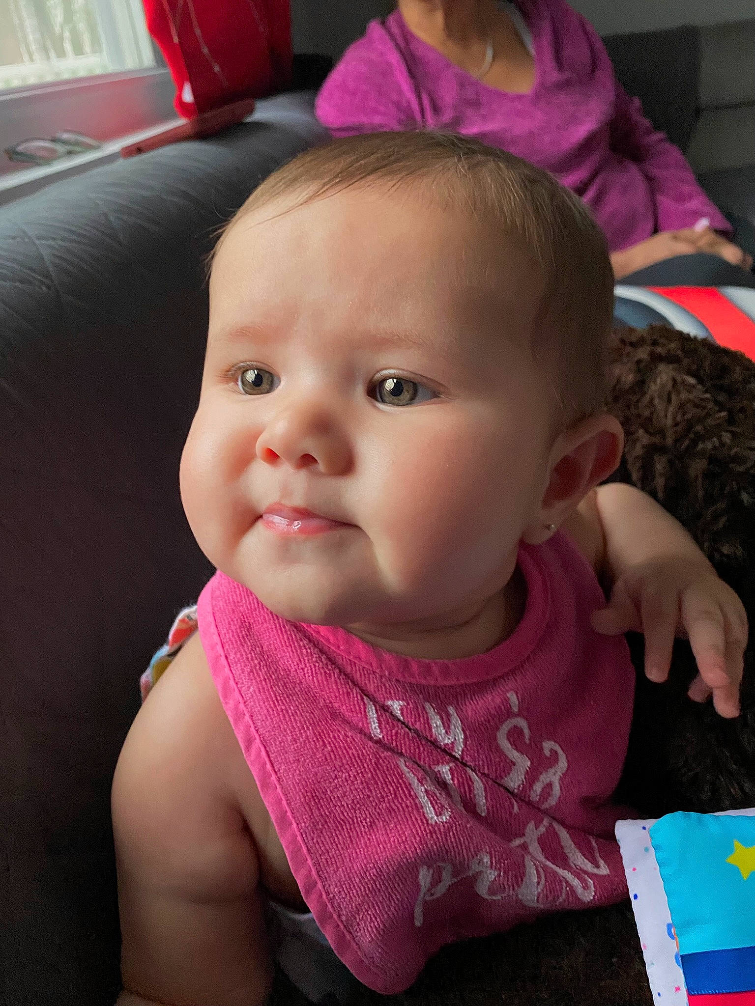 Camila joined the competition — help win amazing prizes! baby, baby_products, baby_toddler_clothing, bib, cheek, child, comfort, ear, eye, eyelash, fun, happy, iris, lip, mouth, nose, person, pink, sitting, skin