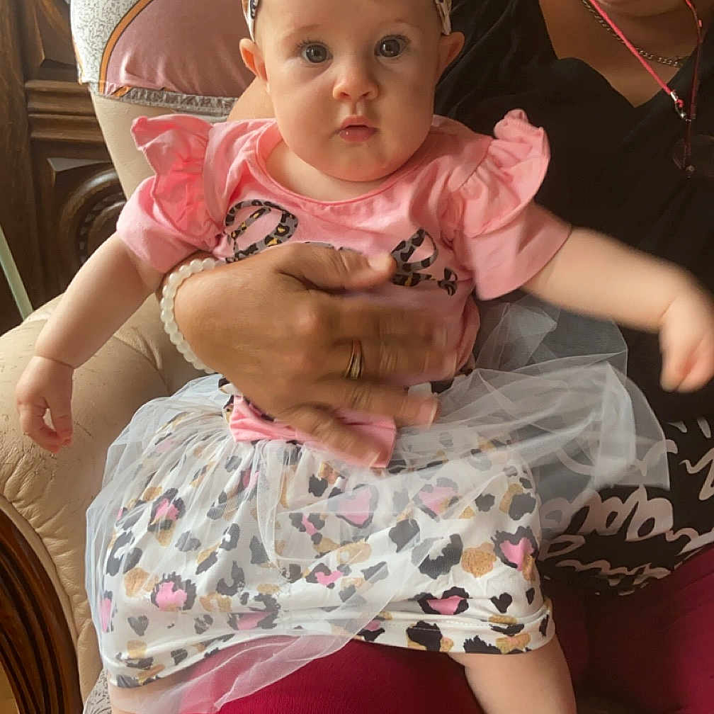 Myla a rejoint le concours — aidez-le/la à gagner de superbes lots ! accessories, baby, chair, clothing, couch, cushion, dress, face, furniture, glasses, hat, head, homedecor, hosiery, people, person, photography, portrait, sitting, sock