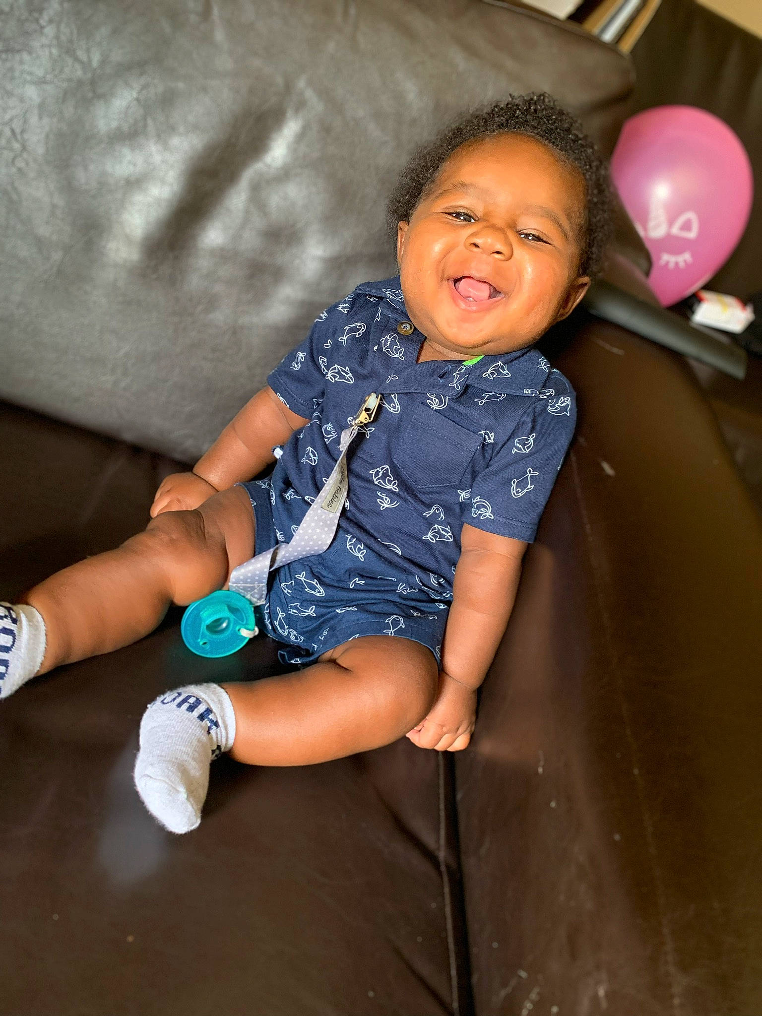 Jahari is registered to the contest to win money with this photo: arm, baby, child, facial_expression, fun, happy, laugh, leg, person, play, recreation, sitting, skin, smile, toddler, vacation