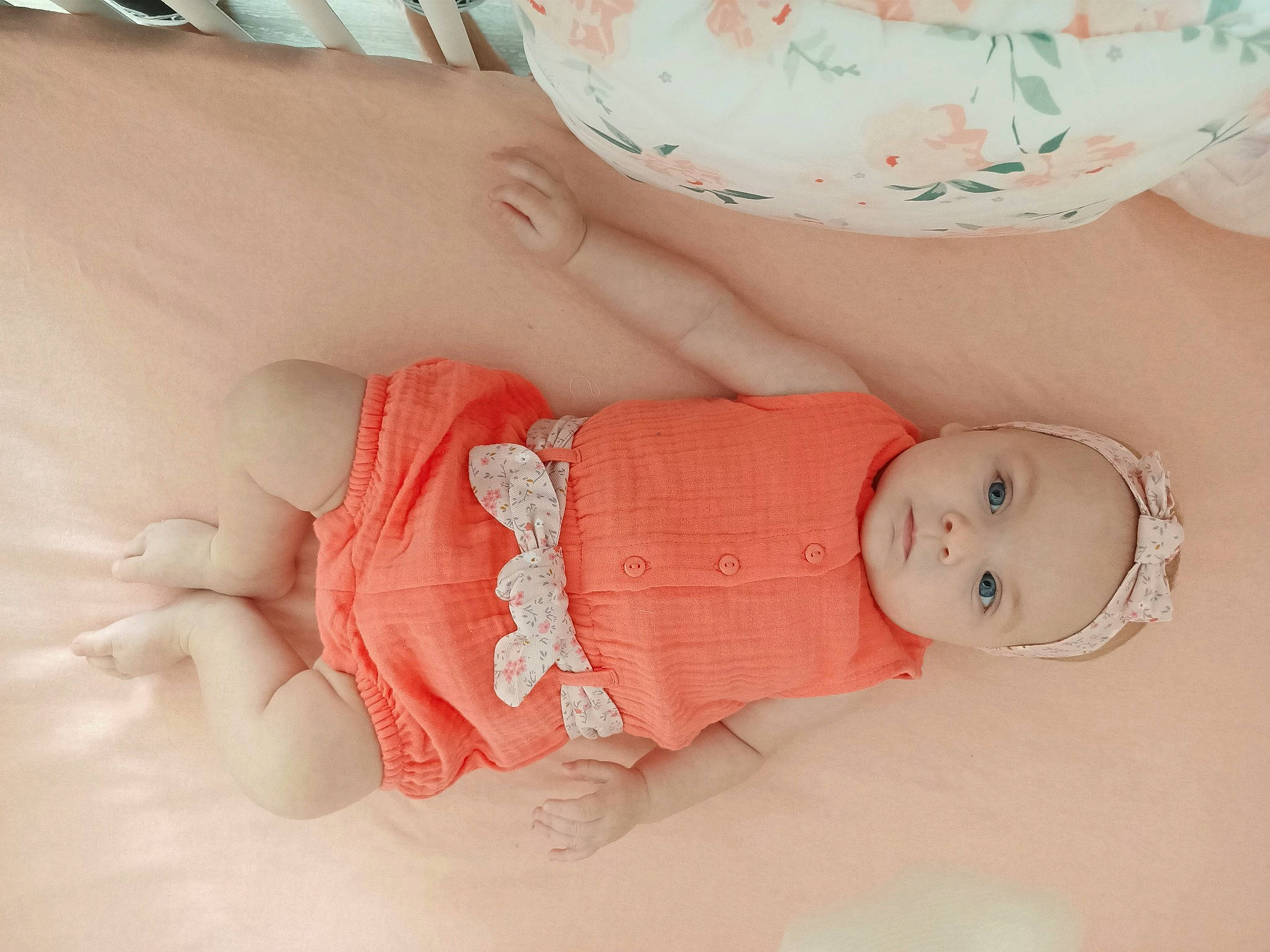 Cyara participe au concours pour gagner de l'argent avec cette photo : arm, baby, baby_products, baby_toddler_clothing, cheek, comfort, dress, eye, finger, hand, human_body, iris, leg, lip, pattern, person, pink, skin, sleeve, stomach