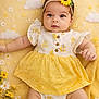 baby, infant, cute, yellow, headband, flower, dress, blanket, portrait, big_eyes, smiling, hand, leg, shoe, daisy, clouds, patterned_background, studio_style, lying_down, soft_texture