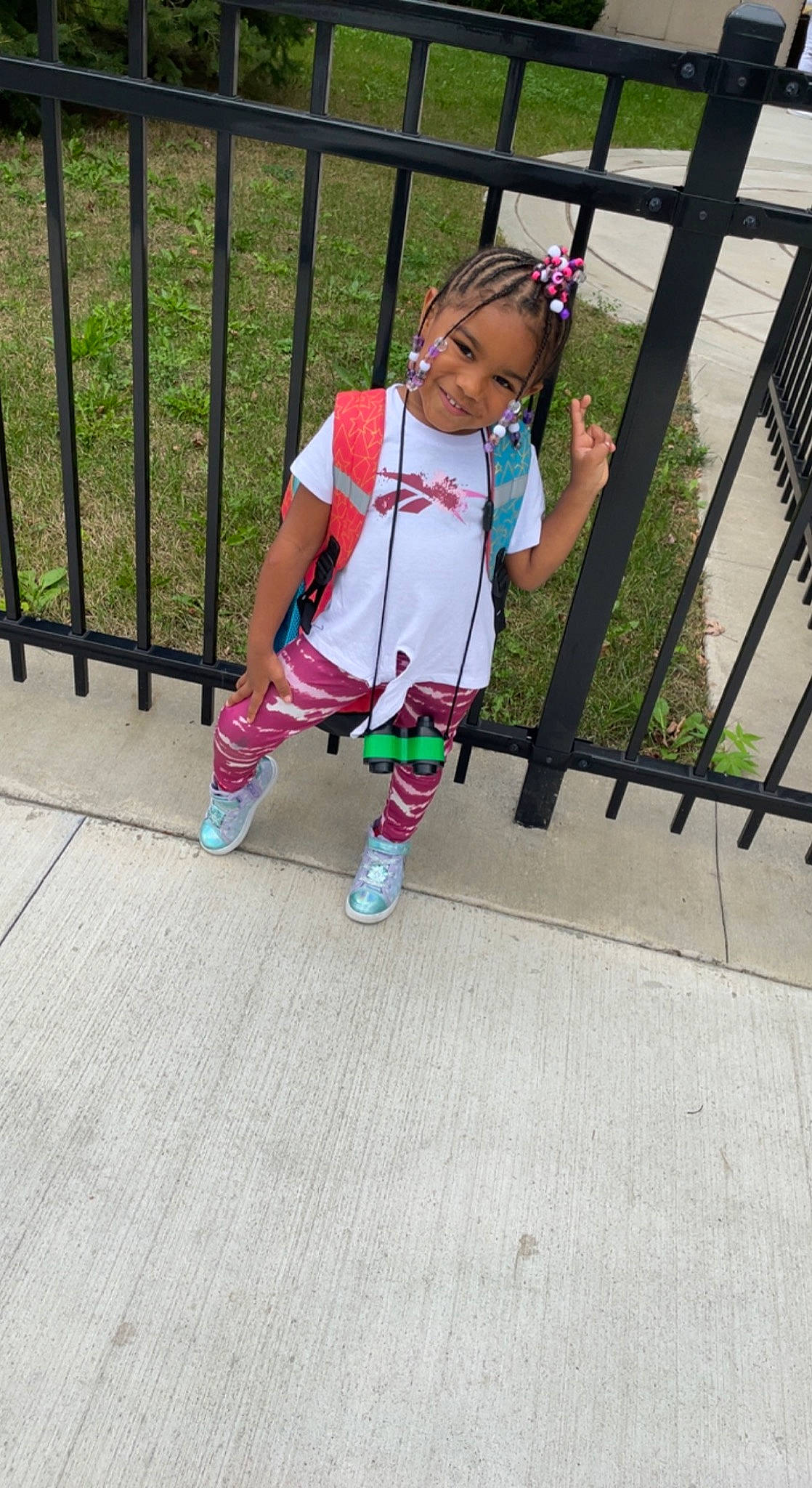 Janiyah joined the competition — help win amazing prizes! baby_toddler_clothing, bag, fence, handrail, hat, human_leg, joy, leg, leisure, luggage_and_bags, magenta, pattern, person, plant, recreation, shorts, sleeve, sneakers, sock, t_shirt