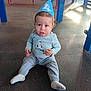 Oliver joined the competition — help win amazing prizes! child, toddler, baby, party_hat, playground, slide, sitting, rubber_floor, socks, blue_shirt, goose_print, surprised_expression, looking_at_camera, candid, celebration, indoor_playground, play_equipment, soft_light, one_person, floor_texture