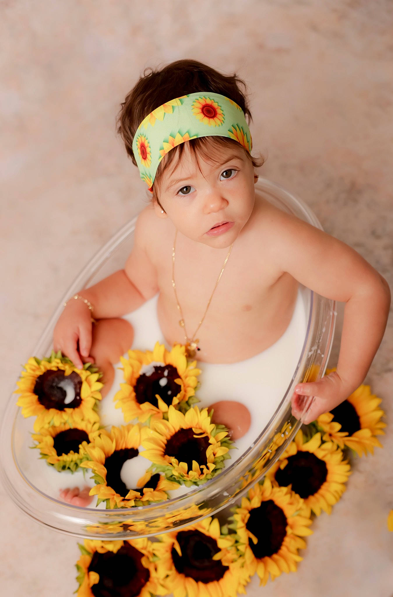 Daphne is registered to the contest to win money with this photo: arm, baby, baby_products, baby_toddler_clothing, birthday, cap, costume_hat, event, eyelash, fashion_accessory, fruit, hair_accessory, happy, headband, headpiece, headwear, jewellery, necklace, person, sugar_cake