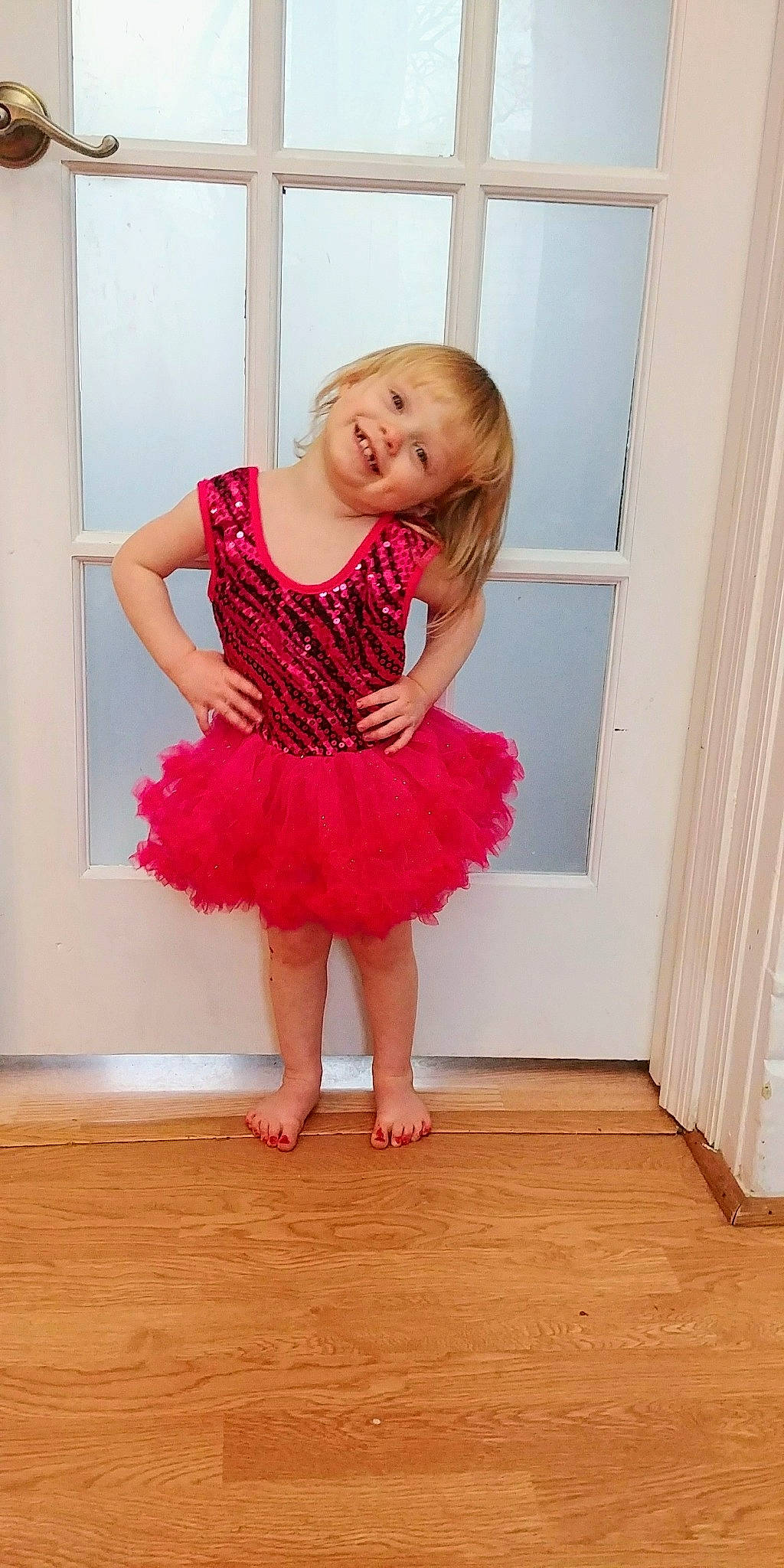 Veda is registered to the contest to win money with this photo: ballet_tutu, child, clothing, costume, dance, dance_dress, dancer, floor, flooring, fun, girl, joint, leg, performing_arts, pink, red, shoulder, sportswear, standing, toddler