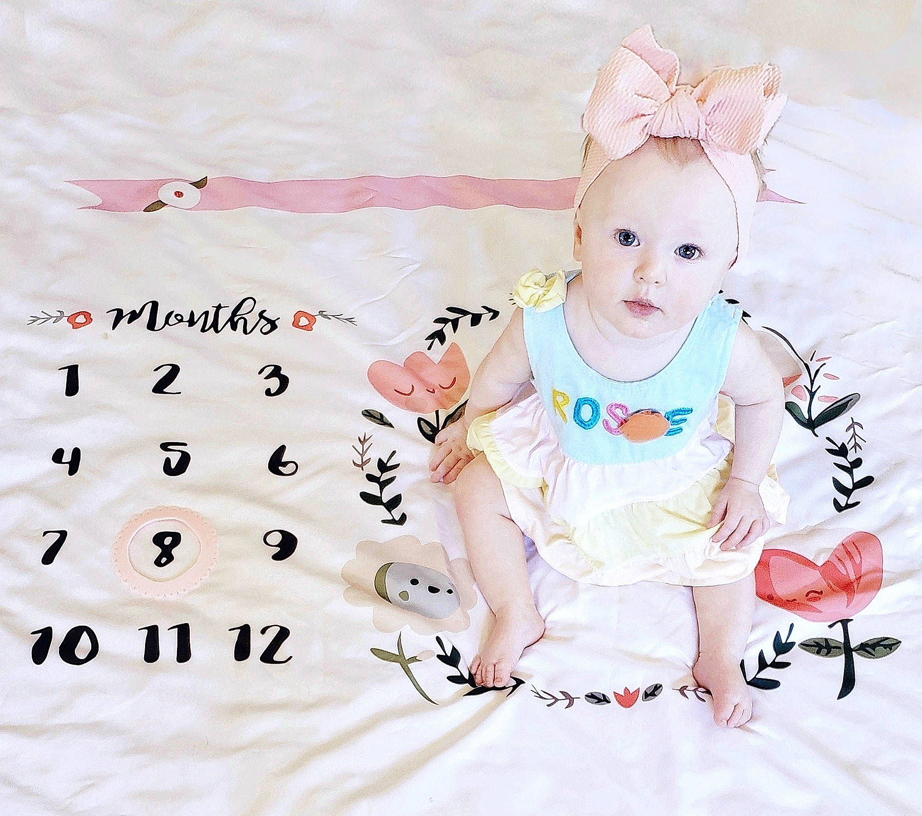 Primrose joined the competition — help win amazing prizes! baby, baby_products, baby_toddler_clothing, child, costume_hat, facial_expression, fashion_accessory, font, happy, headband, headpiece, linens, magenta, pattern, person, pink, sitting, sleeve, t_shirt, textile