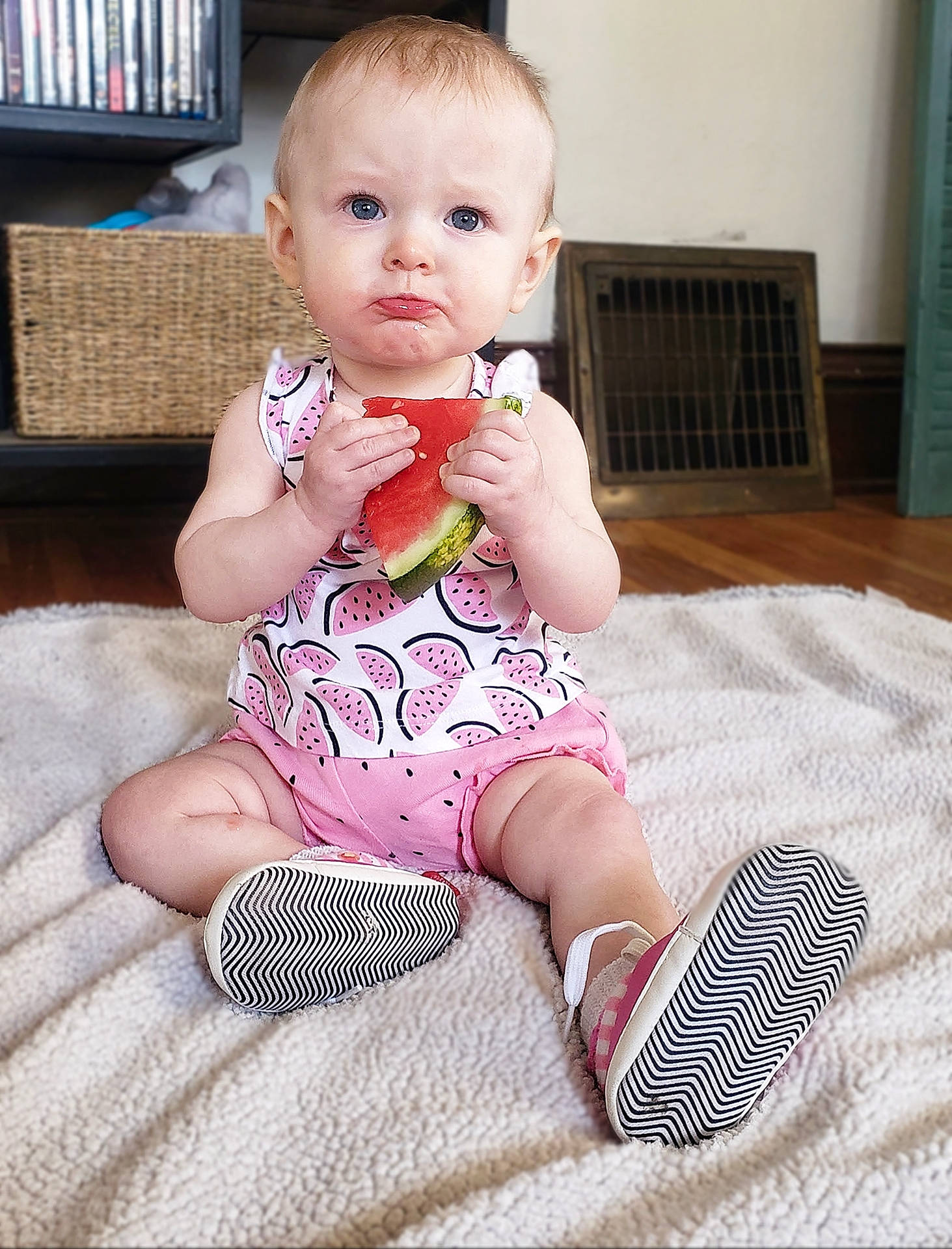 Primrose is registered to the contest to win money with this photo: arm, baby, baby_toddler_clothing, cheek, child, comfort, eye, finger, floor, flooring, human_body, iris, knee, leg, person, pink, skin, sleeve, sock, thigh