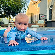 Luca is registered to the contest to win money with this photo: baby, backyard, blue, chair, child, crawling, face, fence, house, outdoor, playful, pool, reflection, summer, sunlight, swimsuit, tree, water, water_droplets, young_child
