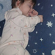 Zya is registered to the contest to win money with this photo: baby, blanket, blue, child, closeup, cozy, cute, face, hair, hand, indoors, infant, pajamas, pattern, peaceful, plush_toy, rest, sleeping, soft_toys, stars