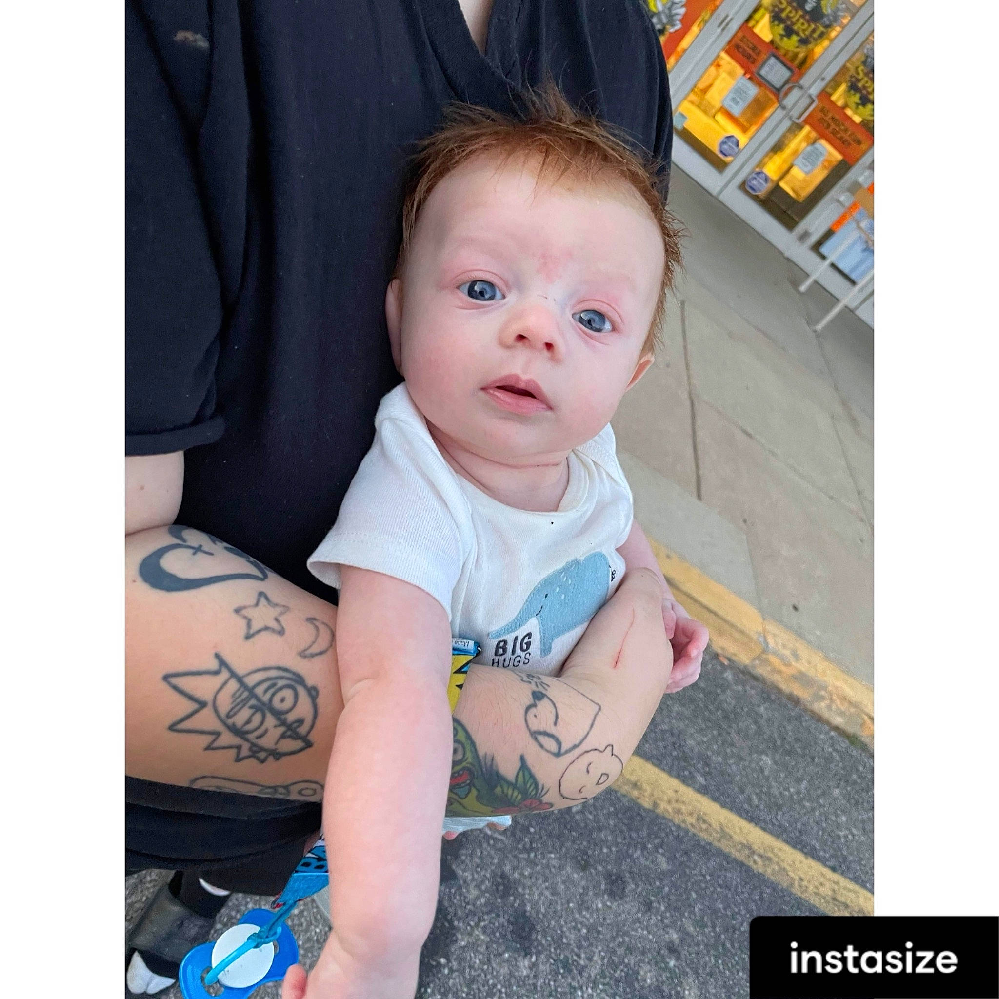 Louie is registered to the contest to win money with this photo: arm, baby, baby_products, baby_toddler_clothing, child, dress, elbow, electric_blue, eye, face, hand, happy, neck, pattern, person, shelf, sitting, sleeve, t_shirt, toddler