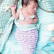 Alivia joined the competition — help win amazing prizes! newborn, baby, sleeping, mermaid_costume, crochet, purple, mint_green, blanket, starfish, seashell, soft_texture, portrait, cute, infant, resting, props, underwater_theme, handmade, baby_photography, peaceful