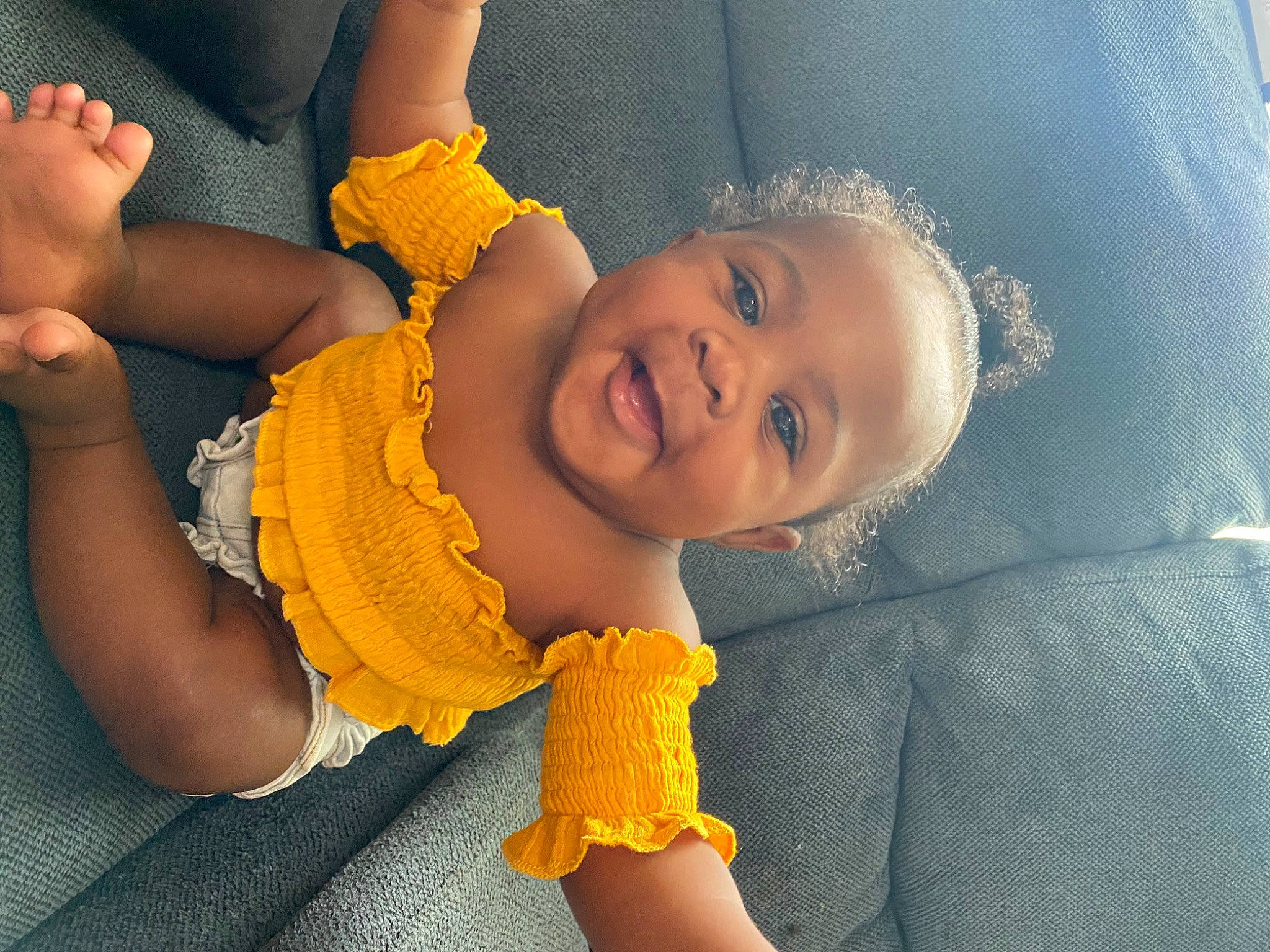 Laylani is registered to the contest to win money with this photo: arm, baby, baby_toddler_clothing, beauty, cheek, child, fun, gesture, hand, happy, human, iris, mouth, person, product, skin, smile, textile, thumb, toddler
