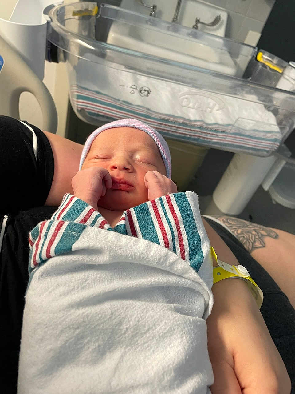 Ryder joined the competition — help win amazing prizes! newborn, baby, sleeping, hospital, blanket, person, arm, tattoo, hospital_bassinet, sink, hat, wrapped, closeup, rest, infant, healthcare, patient, new_life, care, peaceful